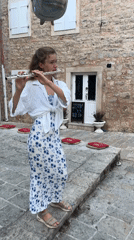 Street flute performance and child's playground time in Budva