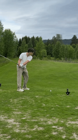 Morning golfer plays under overcast skies in Norway