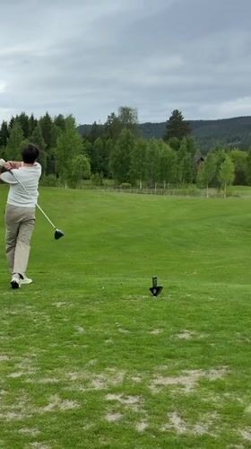 Morning golfer plays under overcast skies in Norway