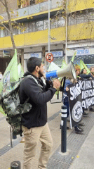 Man with megaphone speaks on Santiago street