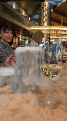 Woman dines at Sofia restaurant with chilled beverages