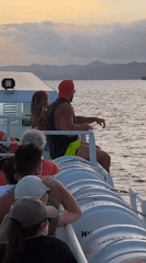 Sunset boat ride with passengers near Karangasem, Indonesia