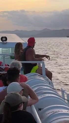 Sunset boat ride with passengers near Karangasem, Indonesia