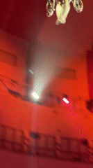 Female aerialist performs aerial routine in Moscow theater auditorium