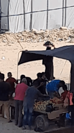 Street cart market activity in al-Qarara, Gaza