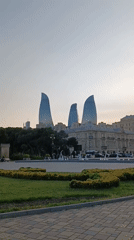 Afternoon stroll documented through Baku waterfront park near Flame Towers