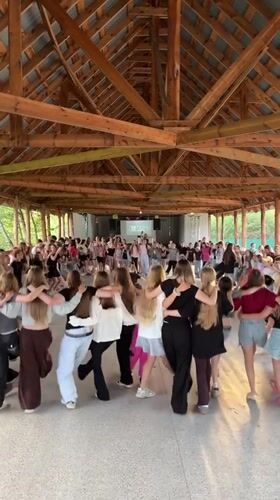 Circle dancing in a wooden outdoor pavilion, Krasnoturansk