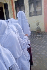 Students gather, hibiscus blooms captured in Keudekrueng, Indonesia