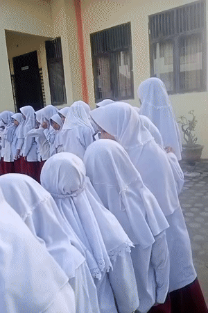 Students gather, hibiscus blooms captured in Keudekrueng, Indonesia