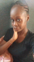 Woman records selfies indoors in Akwanga, Nigeria