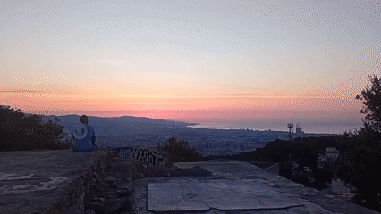 Sunrise over Barcelona from a hilltop perch