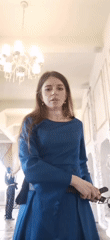 Woman models outfits, plays vintage piano in Moscow interior