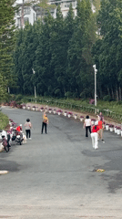 Street badminton game and bicycle rider observed in Da Lat