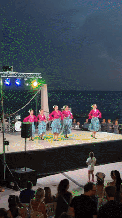 Synchronized dance group performs outdoors in Es Camp De Mar