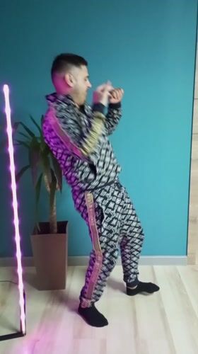 Man engages in playful indoor activities in Pervomaysky home