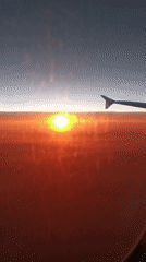 Airline passenger captures sunset view over Austrian Alps