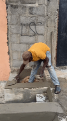 Construction worker builds concrete structures in Ado Nigeria