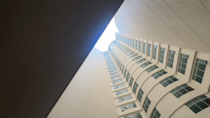 Upward view of curved concrete building in Nha Trang