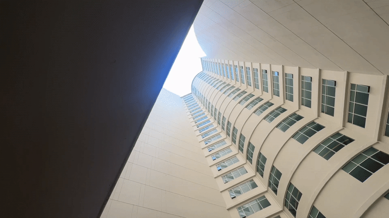 Upward view of curved concrete building in Nha Trang