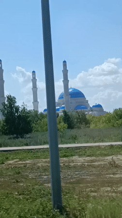 Hazrat Sultan Mosque observed from vehicle in Astana