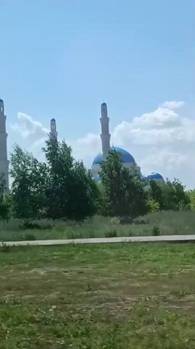 Hazrat Sultan Mosque observed from vehicle in Astana