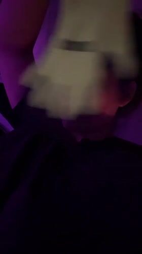 Woman with yellow glove observed in purple-lit Kiryat Bialik residence