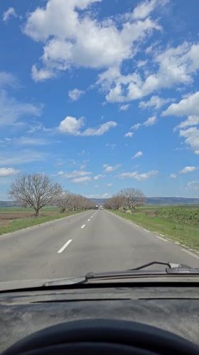 Driver travels rural highway near Zimnitsa, Bulgaria
