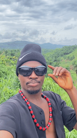 Man in Nike beanie spotted outdoors in Achara, Nigeria