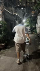Nighttime market activity captured in wet Thủ Đức streets