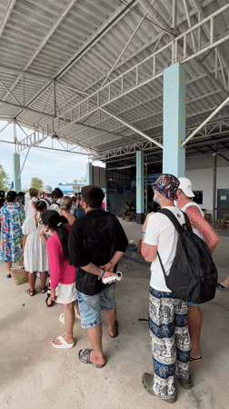Early morning ferry terminal activity in Ratsada, Thailand