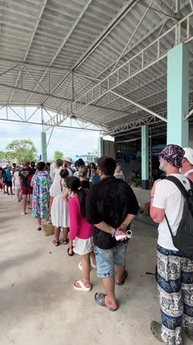 Early morning ferry terminal activity in Ratsada, Thailand
