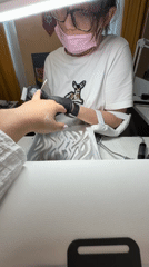 Woman gets manicure service in Vniissok, Russia