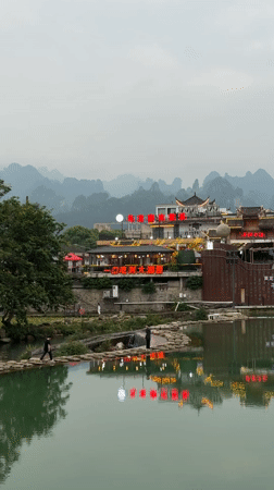 Tourists enjoy morning activities at misty Wulingyuan scenic area