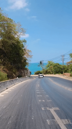 Morning traffic passes through Baan Chaweng Noi, Thailand