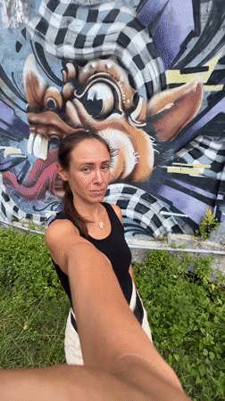 Tourist documents morning visit to Ubud's street art and shops