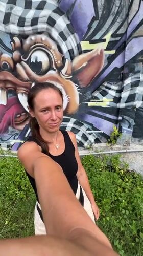 Tourist documents morning visit to Ubud's street art and shops