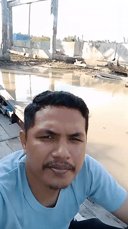 Boat journey through mangrove-lined river in Keudebayu