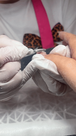 Close-up nail filing session at a Sinyavino salon