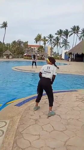 Team dancers perform poolside at Venezuelan beach resort