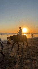 Beach leisure activities documented in Kuta during morning hours