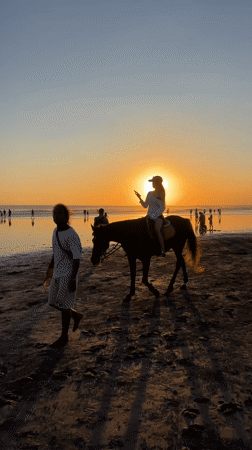 Beach leisure activities documented in Kuta during morning hours