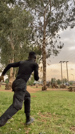 Young men perform acrobatics and dance routines in Vom, Nigeria