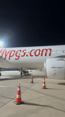 Passengers document evening flights at Turkish airport