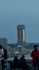Street musician, selfies, illuminated cross mark Sunday in Belgrade