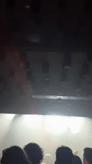 Barcelona music venue captured with dynamic lighting, energetic atmosphere