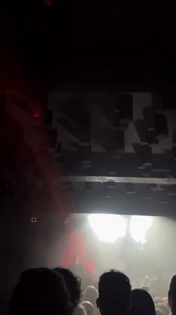 Barcelona music venue captured with dynamic lighting, energetic atmosphere