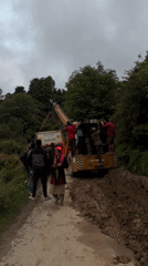 Crane crew recovers stuck TATA truck on muddy Auli road