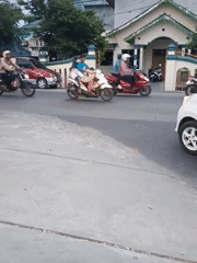 Morning traffic flows past market stalls in Plesungan, Indonesia