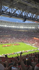 Packed stadium hosts soccer match with red-team players