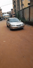 Morning street life documented on dirt roads in Onitsha